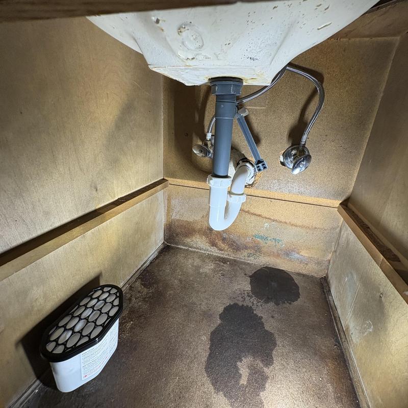 Quarter turn angle stop valves under sink with water stains
