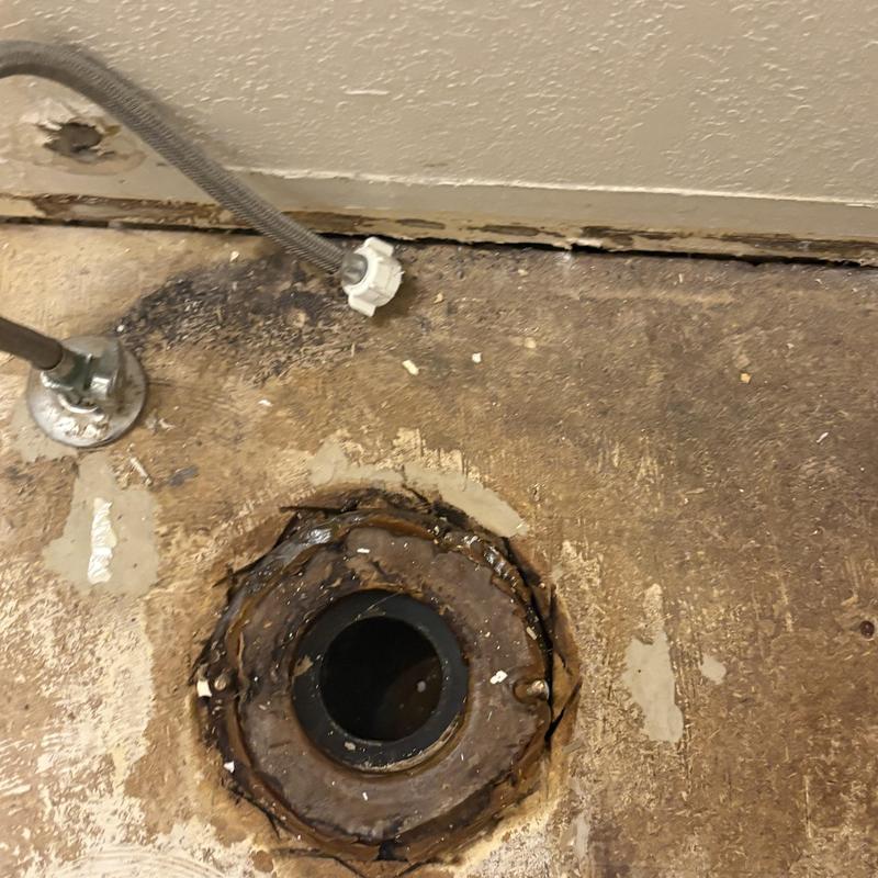 Toilet flange with corroded floor around it Toilet flange with corroded floor around it