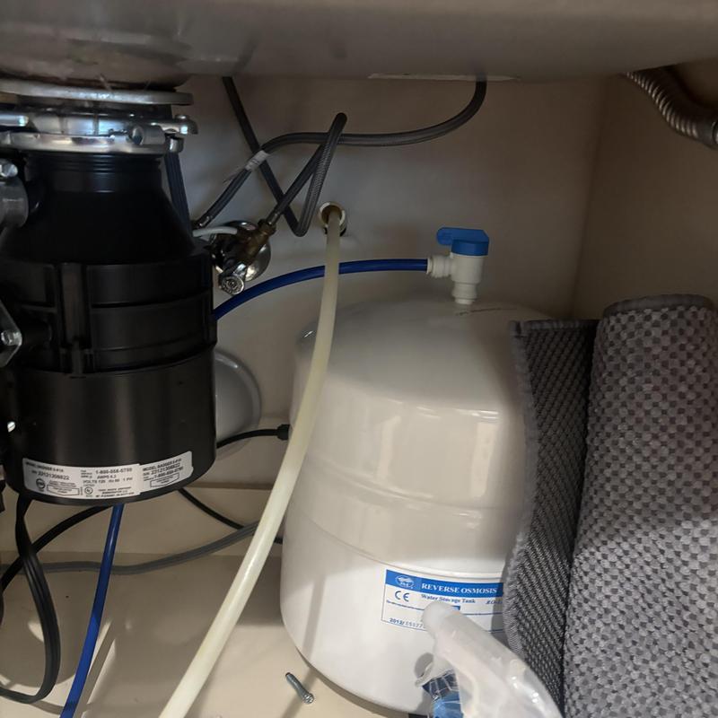Reverse osmosis water storage tank under kitchen sink