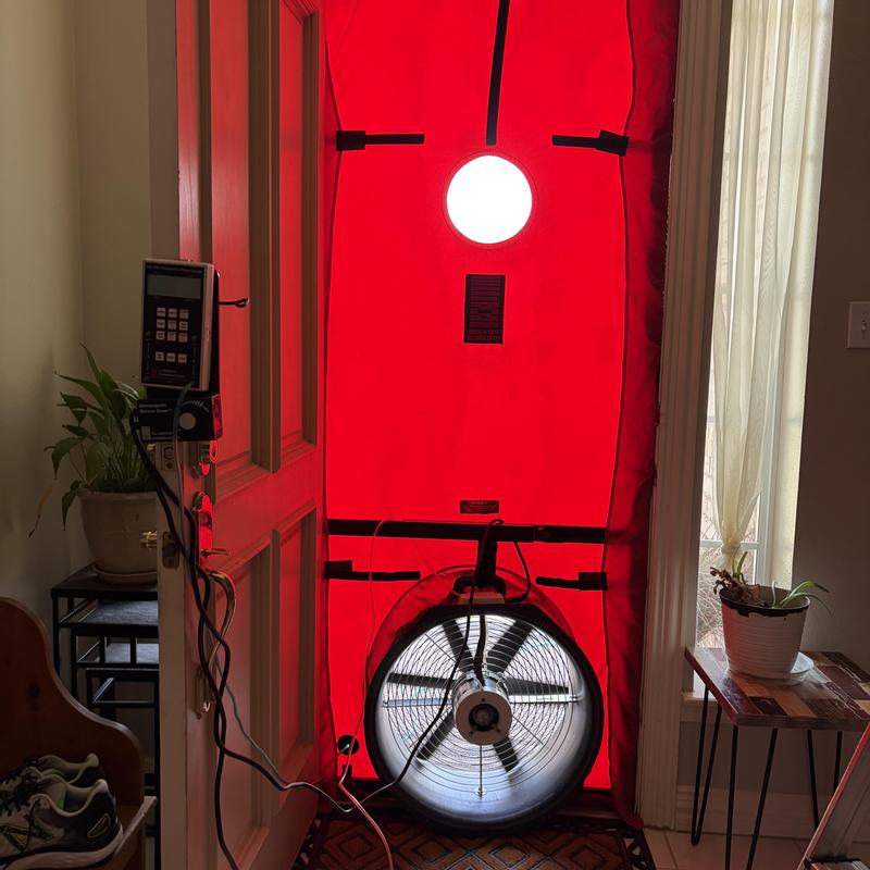 Blower door fan setup for home energy audit