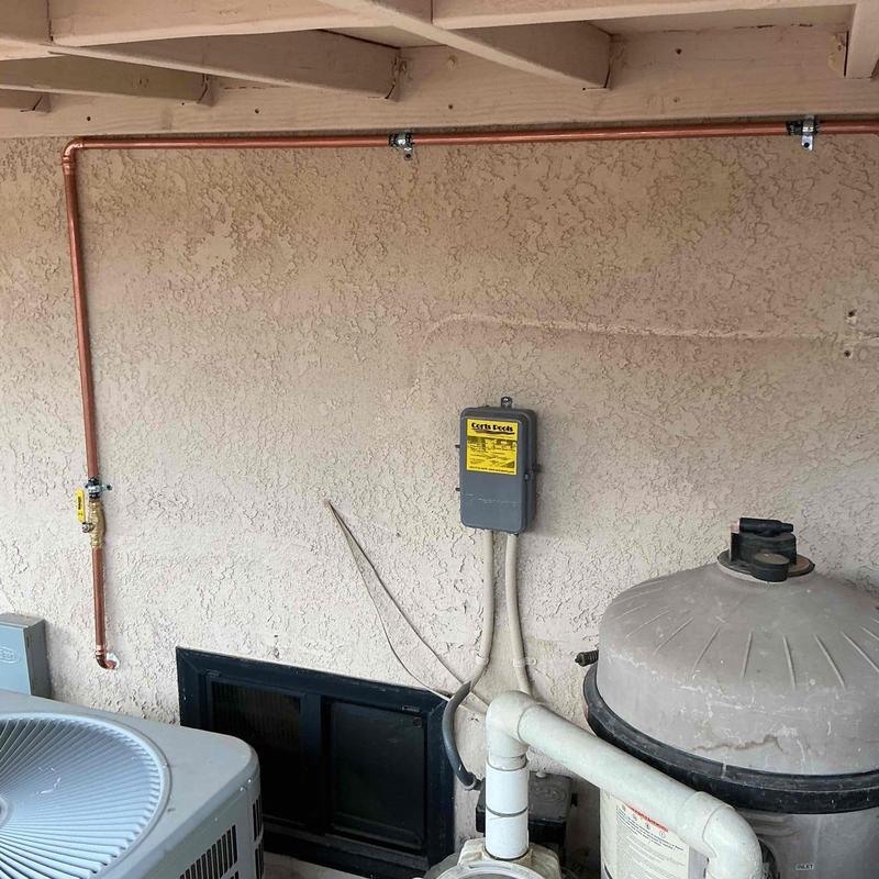Copper pipe installation on exterior wall with valve Copper pipe installation on exterior wall with valve