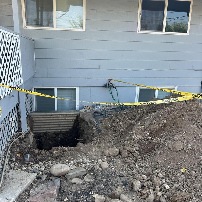 Asbestos concrete sewer line excavation with caution tape Asbestos concrete sewer line excavation with caution tape