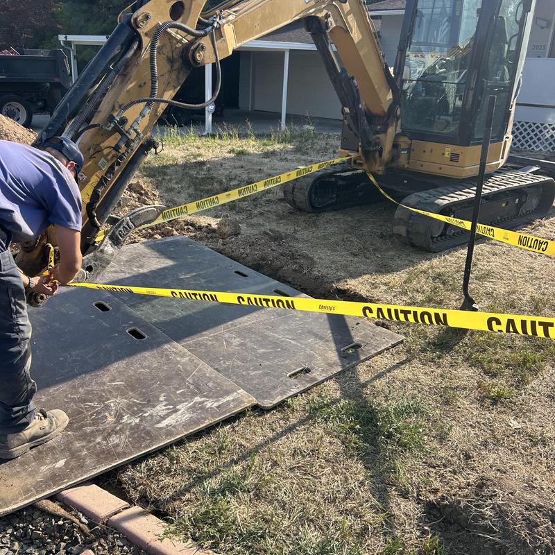 Asbestos concrete sewer line excavation with caution tape Asbestos concrete sewer line excavation with caution tape