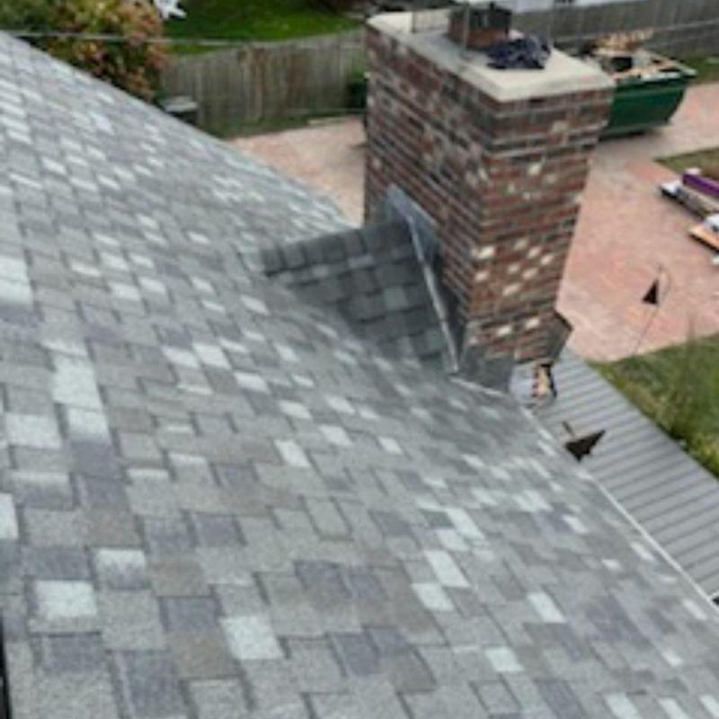 CertainTeed Landmark Pro shingles with chimney flashing CertainTeed Landmark Pro shingles with chimney flashing