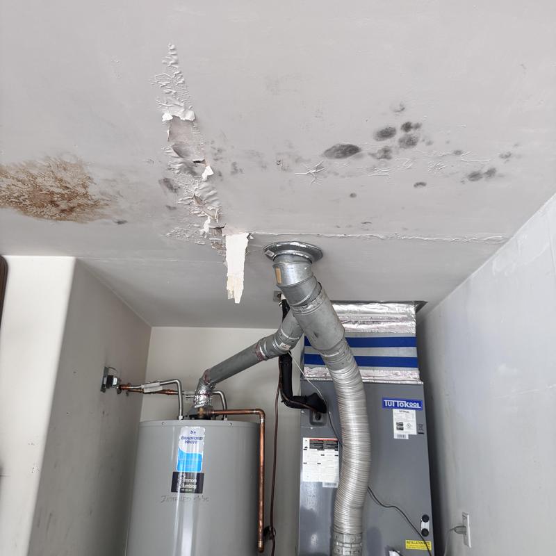 Ceiling water damage above water heater unit Ceiling water damage above water heater unit