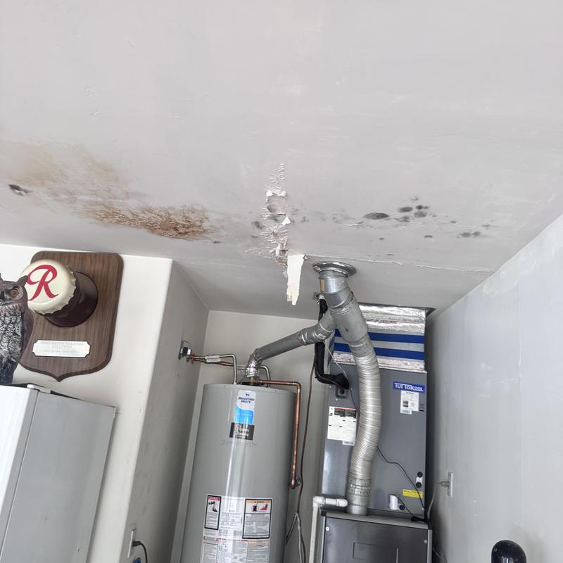 Ceiling water damage above water heater and HVAC system Ceiling water damage above water heater and HVAC system