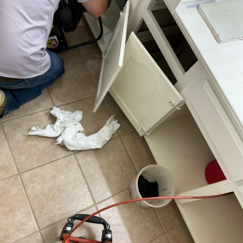 Jack and Jill sink drain line clearing with cable tool