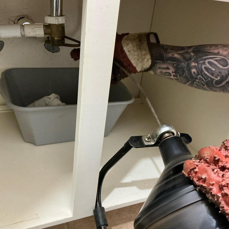 Jack and Jill sink drain line clearing with cable tool