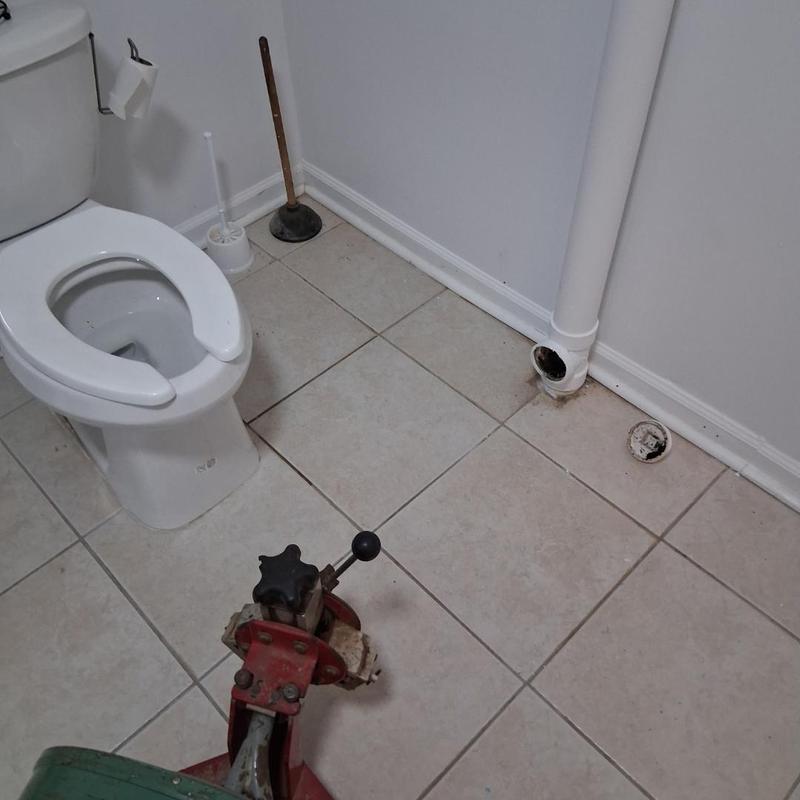Toilet flange installation with plumbing tools in bathroom Toilet flange installation with plumbing tools in bathroom