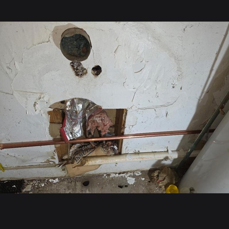 Copper water line with meter templet installed in wall Copper water line with meter templet installed in wall