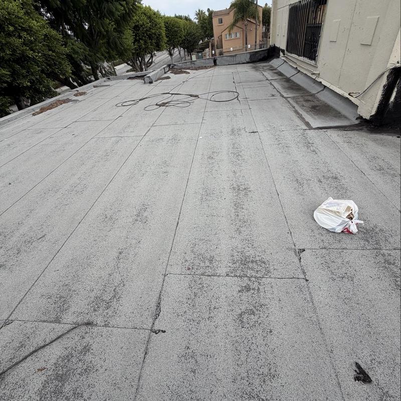 Flat roof torch down membrane inspection view Flat roof torch down membrane inspection view