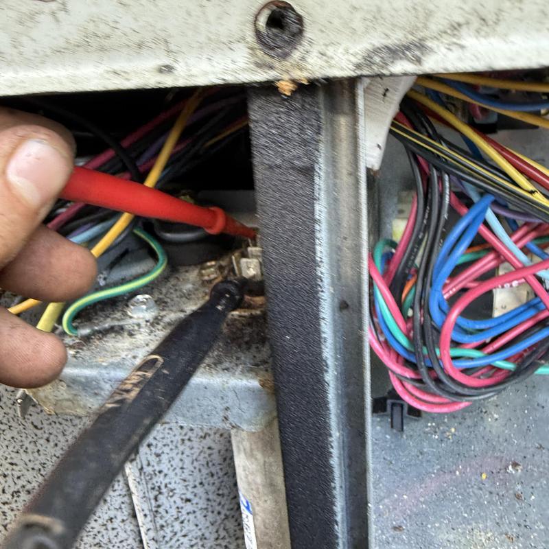 HVAC control board testing with multimeter probes
