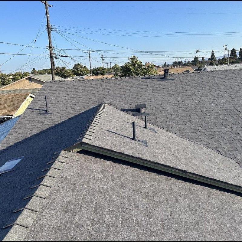 Shingle roof installation with roof vents on house Shingle roof installation with roof vents on house