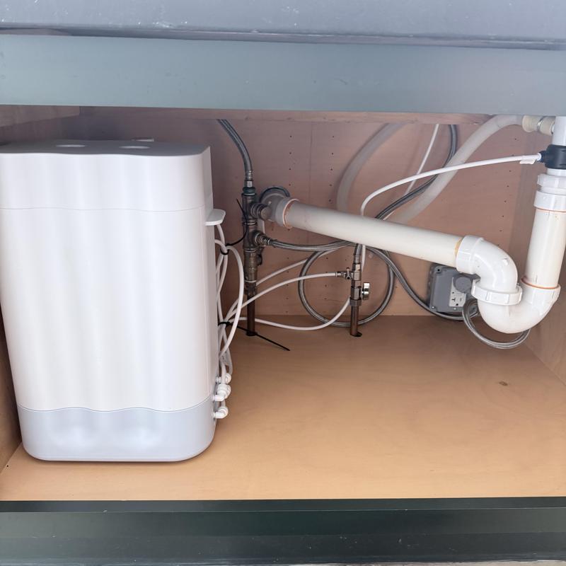 RO system faucet installation under sink with piping