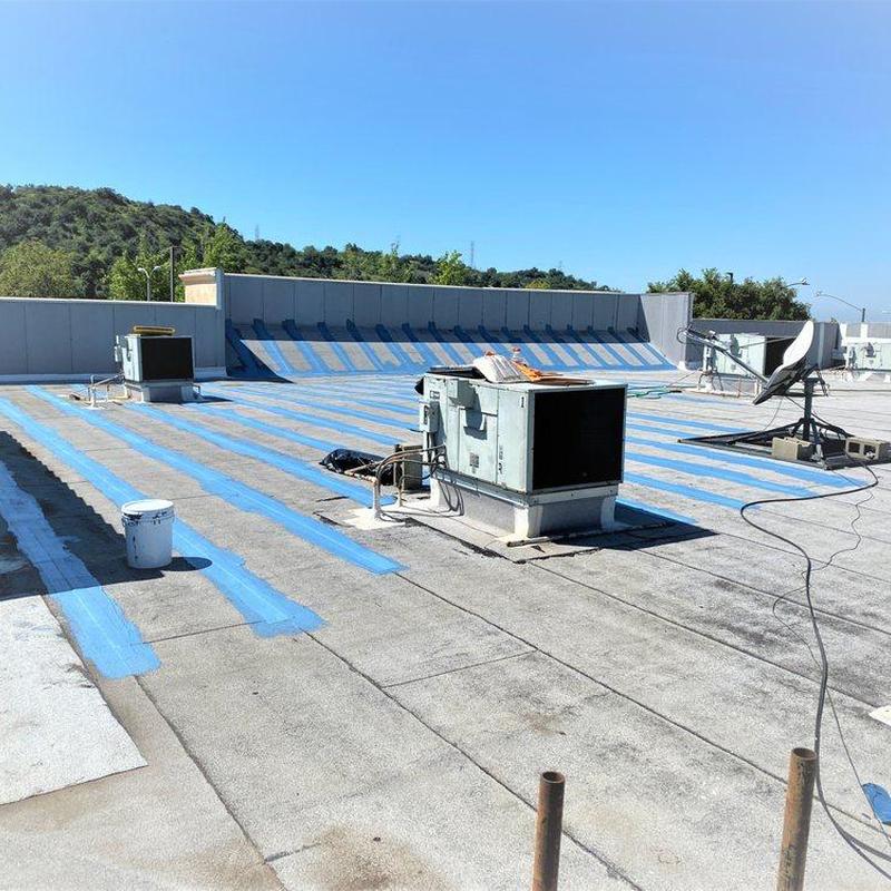 Commercial rooftop HVAC units with maintenance markings Commercial rooftop HVAC units with maintenance markings