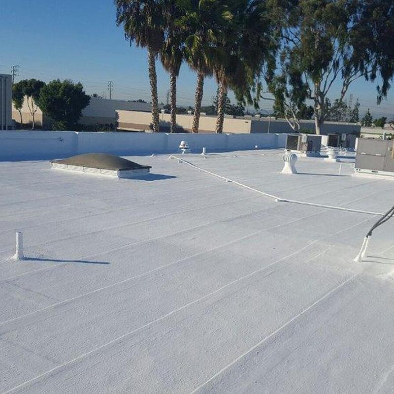 Commercial flat roof with ventilation units and skylight Commercial flat roof with ventilation units and skylight