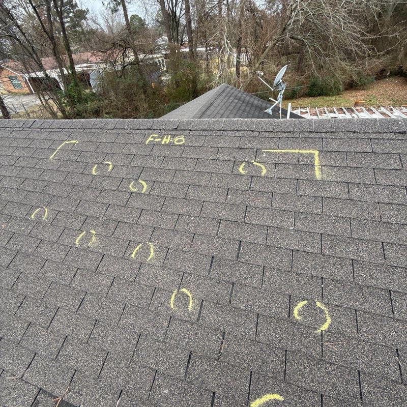 Asphalt shingle roof with hail damage markings