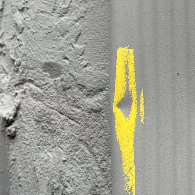 Roof flashing with hail damage and yellow marking