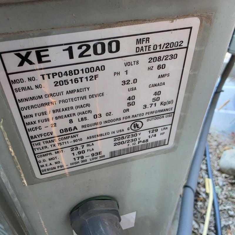 Trane XE 1200 air conditioner model tag close-up Trane XE 1200 air conditioner model tag close-up