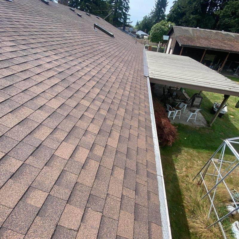 Gutter and roof cleaning with debris removal