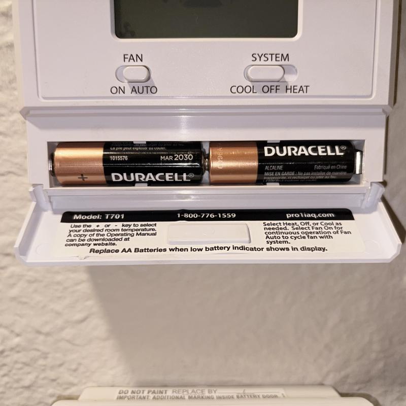 Thermostat battery compartment with Duracell batteries installed