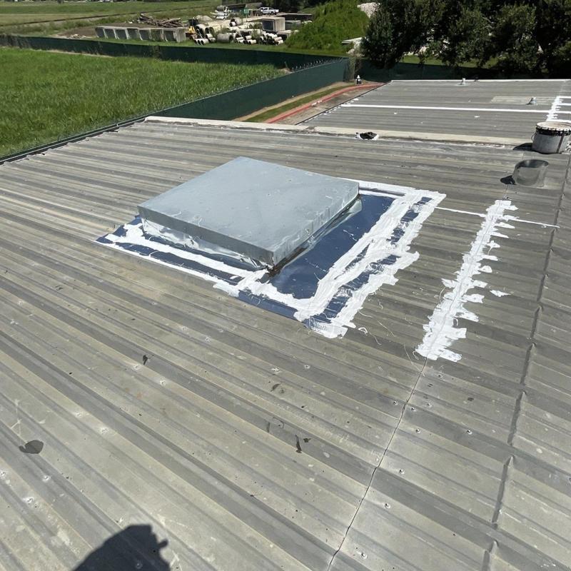 Metal roof skylight flashing with sealant applied Metal roof skylight flashing with sealant applied