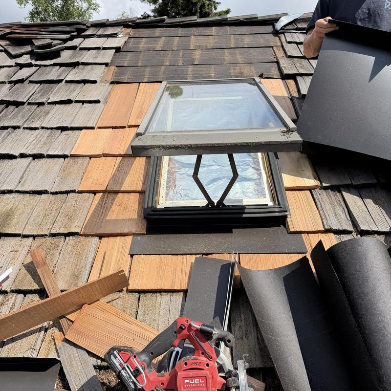 Operable skylight replacement on cedar shake roof Operable skylight replacement on cedar shake roof