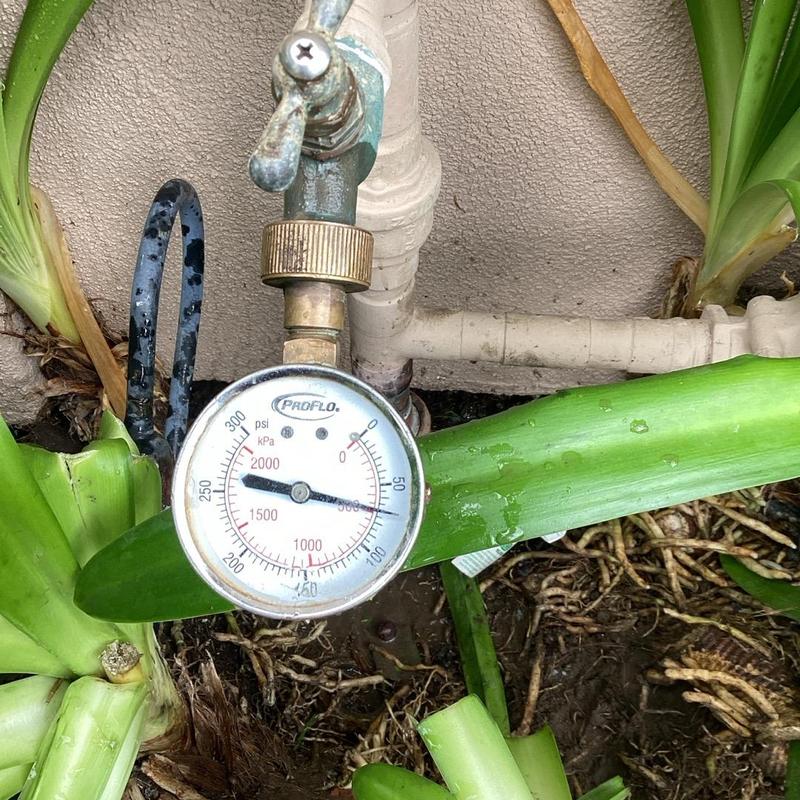 Pressure regulator with attached pressure gauge outdoors