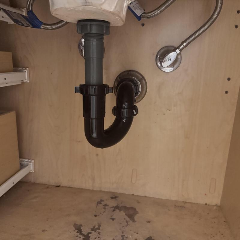 Sink drain trap and angle stop valves under cabinet Sink drain trap and angle stop valves under cabinet