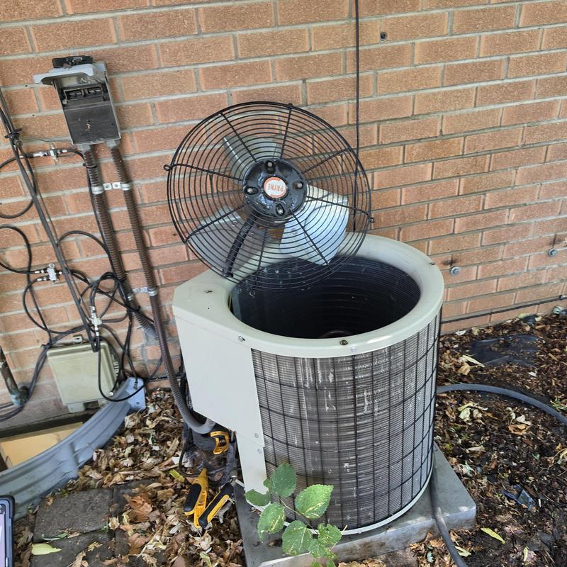 Payne air conditioner unit with fan removed for maintenance Payne air conditioner unit with fan removed for maintenance