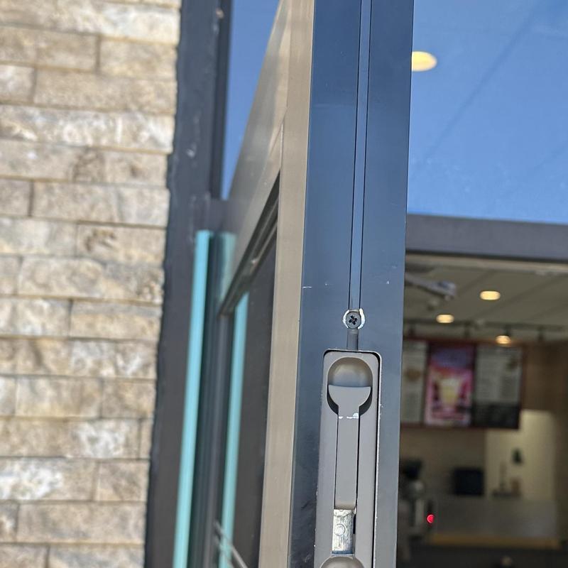 Flush bolt and guide on commercial door edge