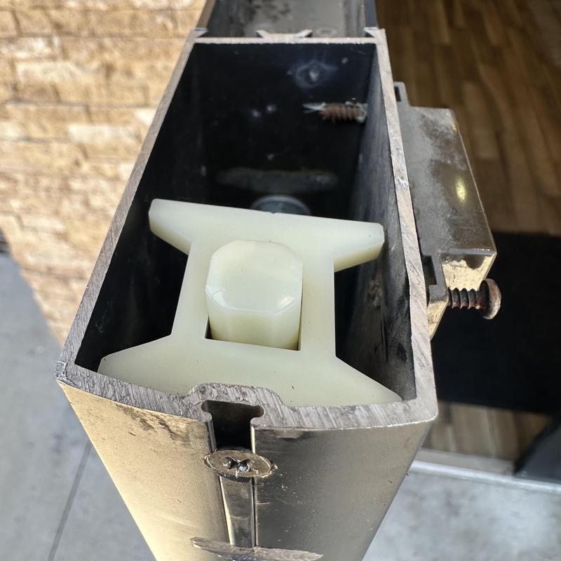 Flush bolt guide inside commercial door frame close-up