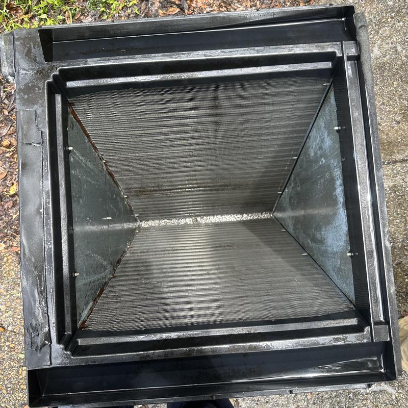 HVAC condenser coil inside metal housing unit