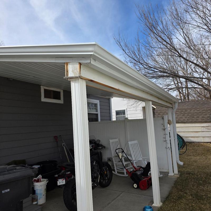 Aluminum gutter coils on covered patio roof edge Aluminum gutter coils on covered patio roof edge