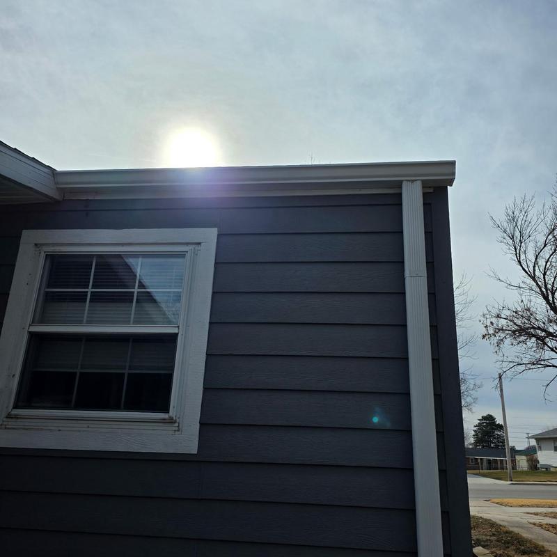 Aluminum gutters and downspout on dark siding Aluminum gutters and downspout on dark siding