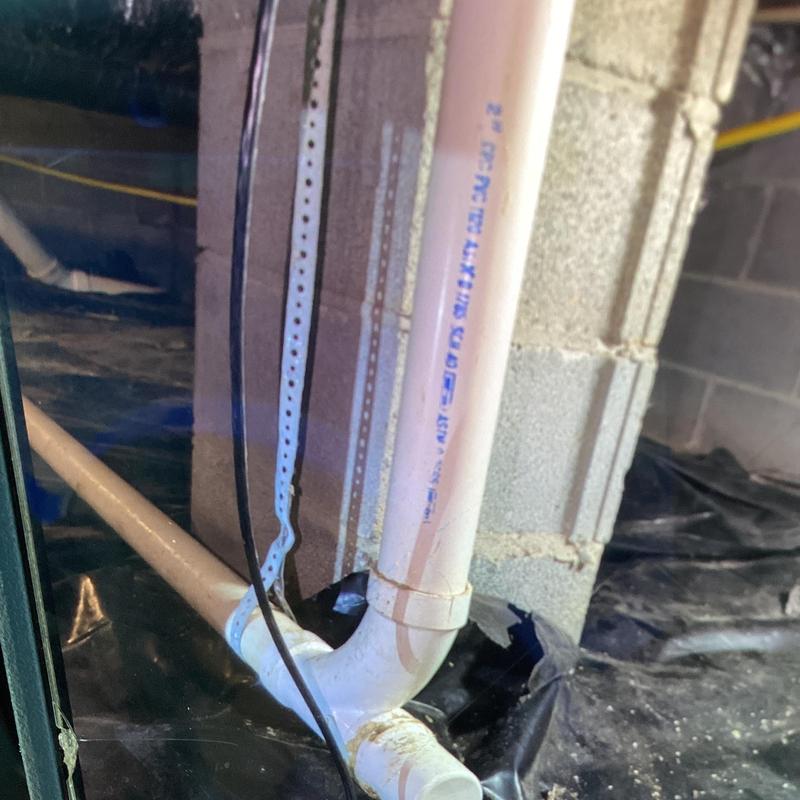 2-inch PVC crossover tee replaced in crawl space