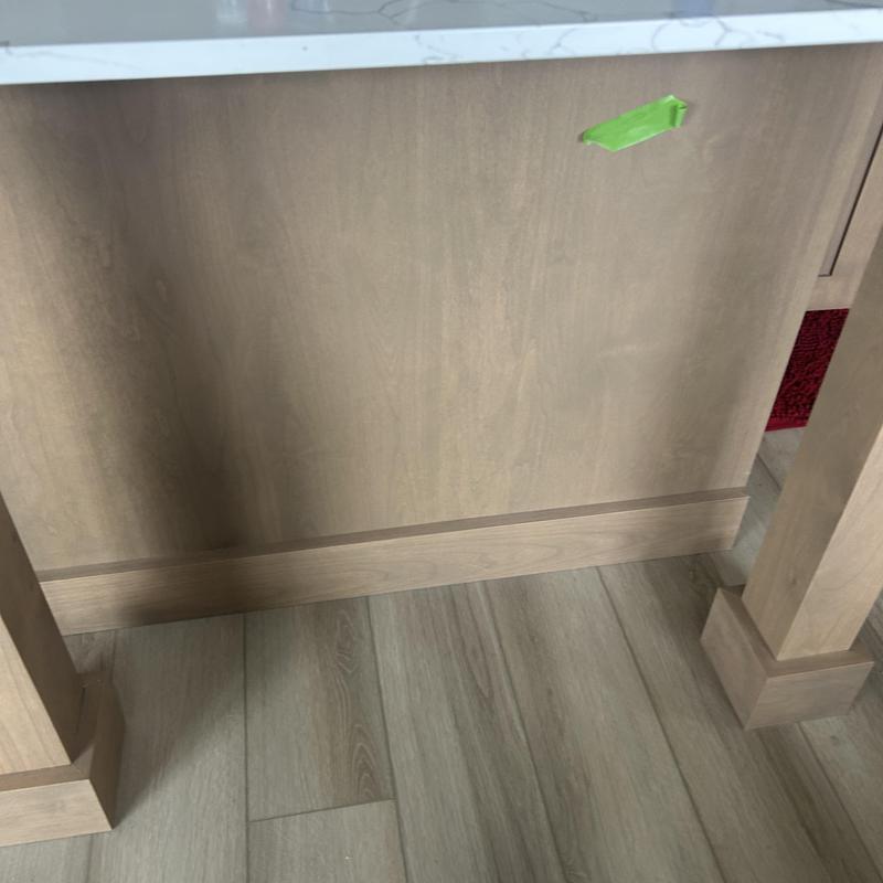 Kitchen island wood panel with green tape marker Kitchen island wood panel with green tape marker