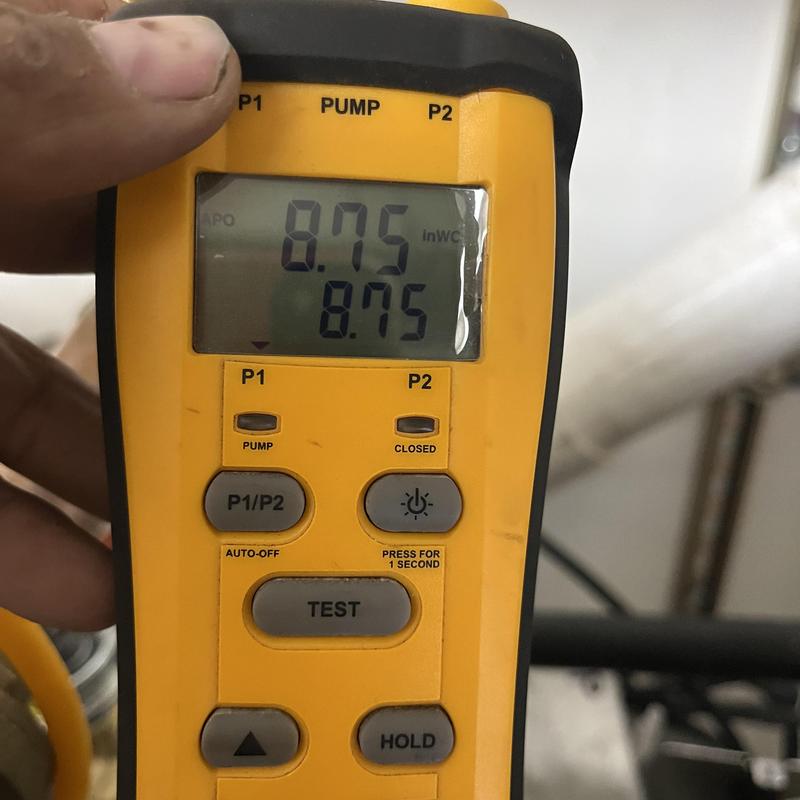 Water column gauge showing gas pressure readings Water column gauge showing gas pressure readings