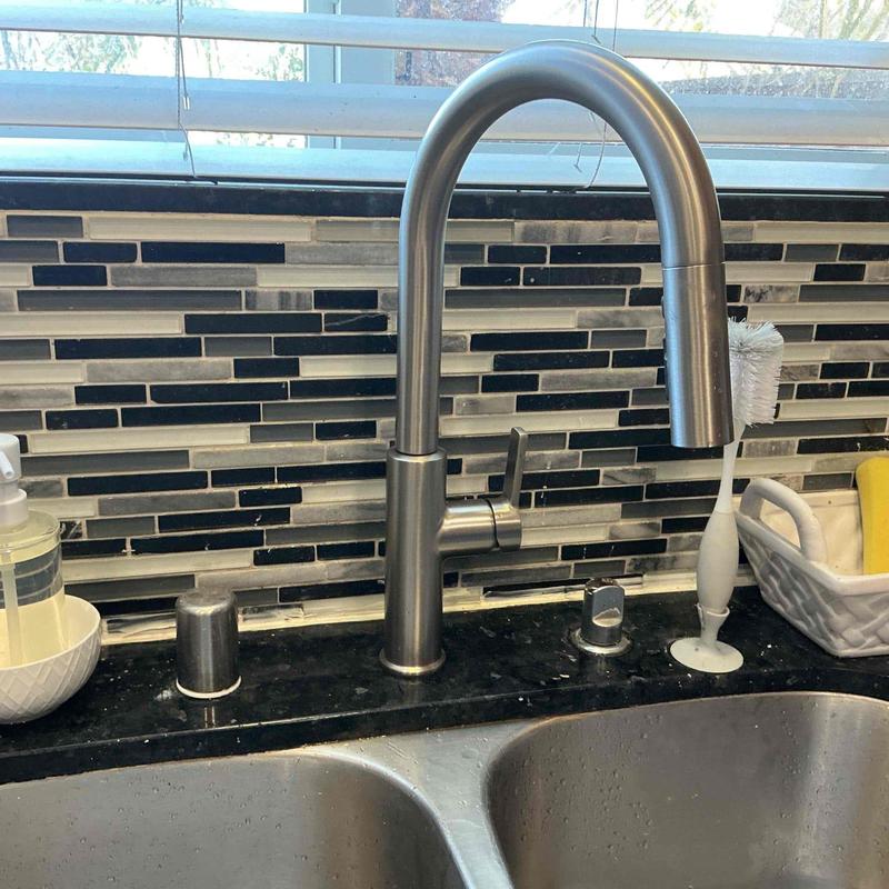 Kitchen sink faucet with pull-down sprayer installed Kitchen sink faucet with pull-down sprayer installed