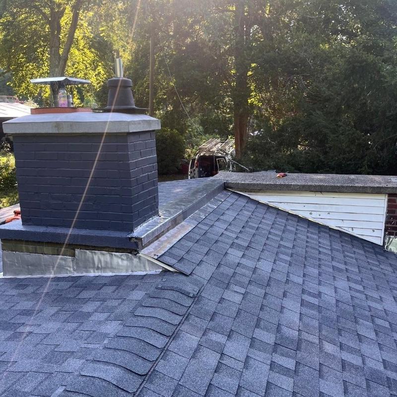 CertainTeed Landmark Pro shingles on roof with chimney CertainTeed Landmark Pro shingles on roof with chimney