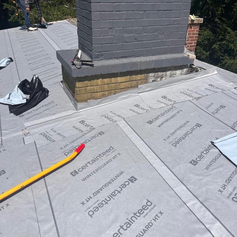 Underlayment installation around masonry chimney on roof Underlayment installation around masonry chimney on roof