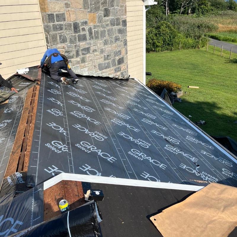 Ice shield installation on roof near chimney Ice shield installation on roof near chimney