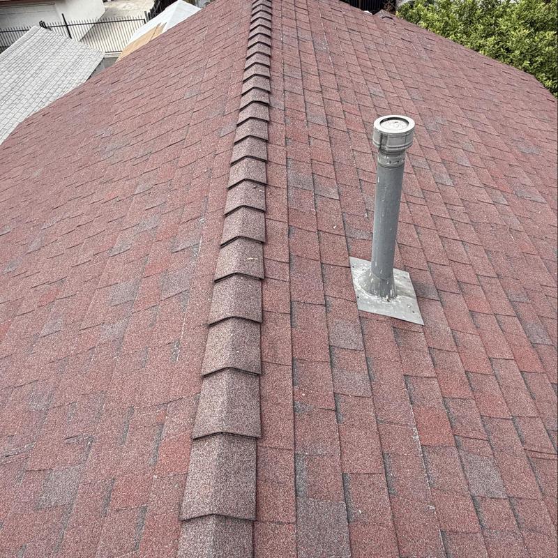 Shingle roof with vent pipe and ridge cap inspection Shingle roof with vent pipe and ridge cap inspection