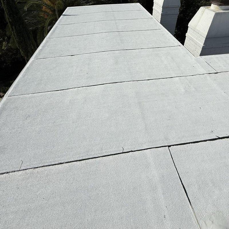 Flat roof membrane on residential building in sunlight Flat roof membrane on residential building in sunlight