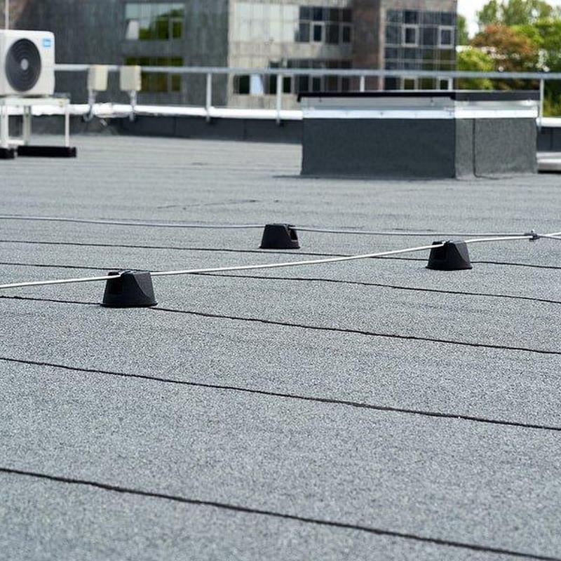 Commercial flat roof with safety line anchors Commercial flat roof with safety line anchors
