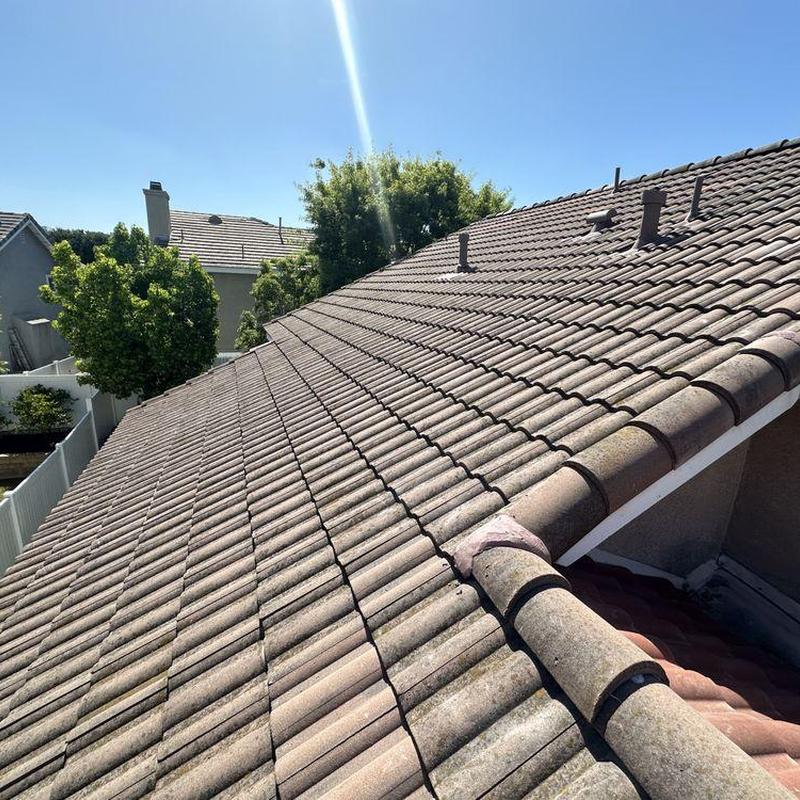 Tile roof with vent pipes and clear sky in Whittier Tile roof with vent pipes and clear sky in Whittier