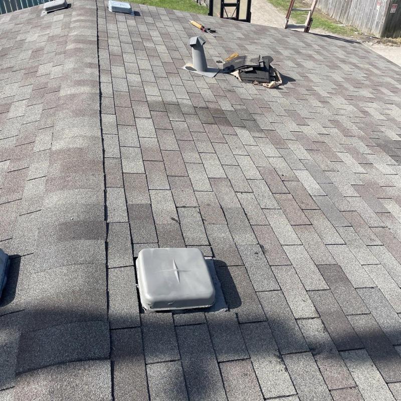 Roof shingles and vent flashing repair on residential roof