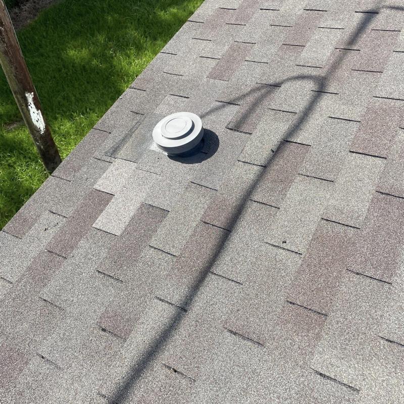 Roof vent with new flashing on shingle roof
