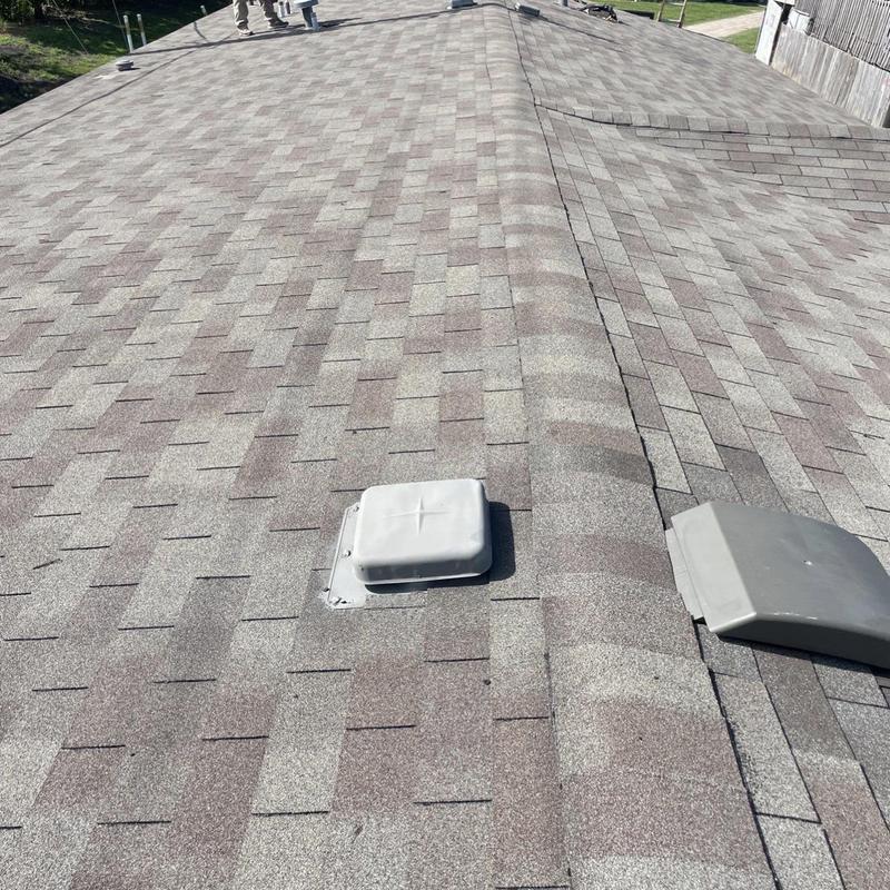 Roof vent flashing and shingle repair on asphalt roof