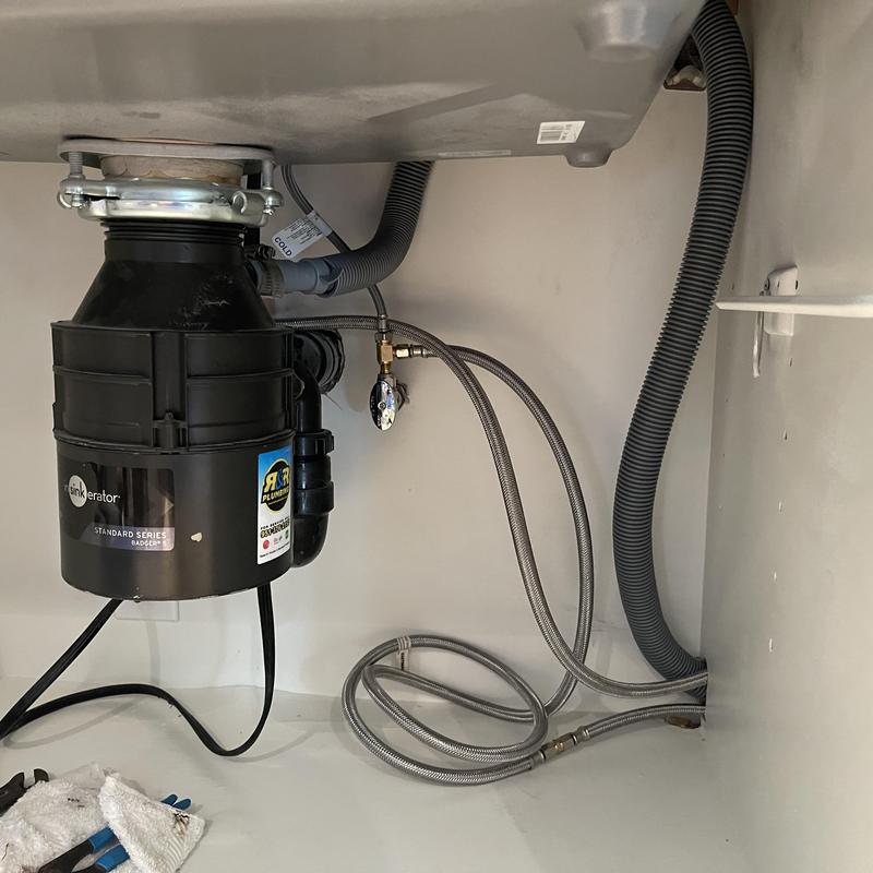 Steel braided water supply line under kitchen sink Steel braided water supply line under kitchen sink